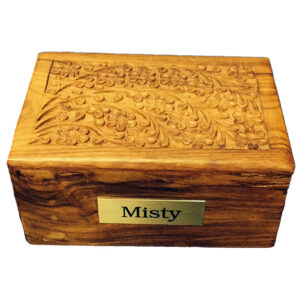 A wooden urn with a name label